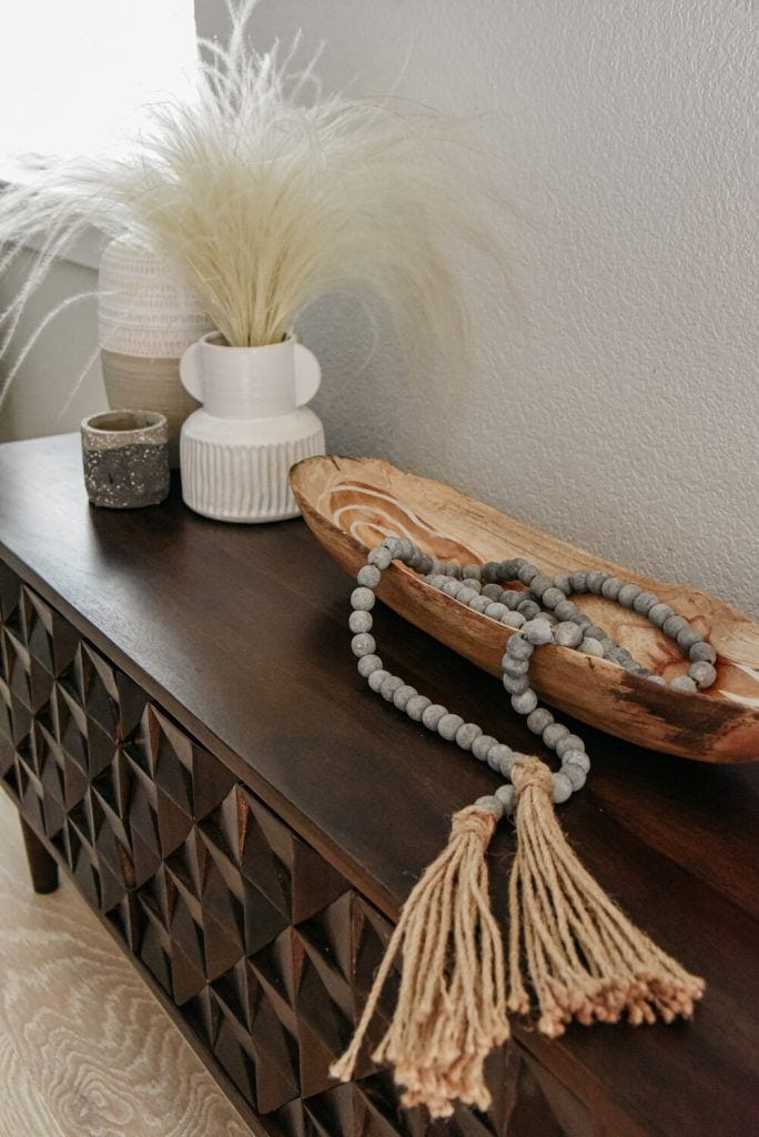 Walnut console table with pampas